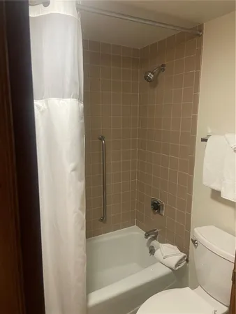 a room with a city view and mountain view