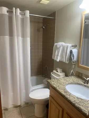 a view of a bathroom from a hallway