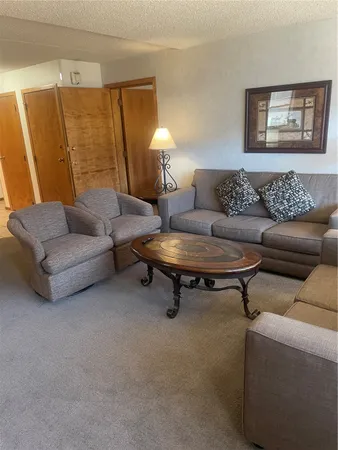 a bedroom with furniture and a chandelier