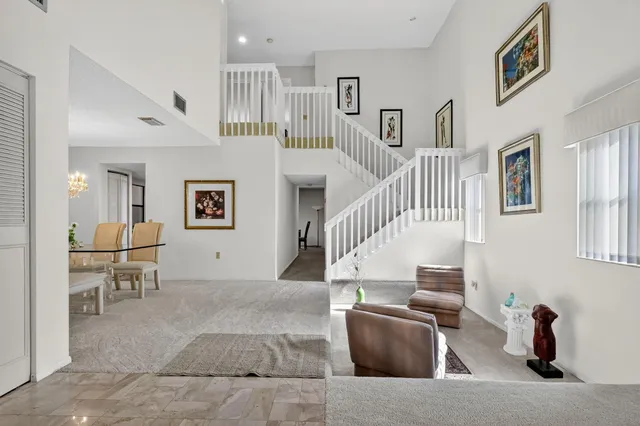 a living room with furniture and a chair