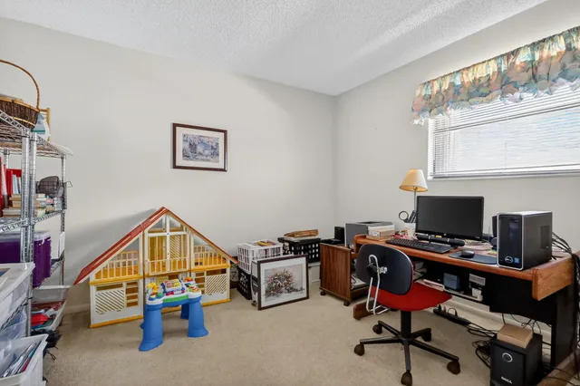 a bedroom with a bed and a mirror