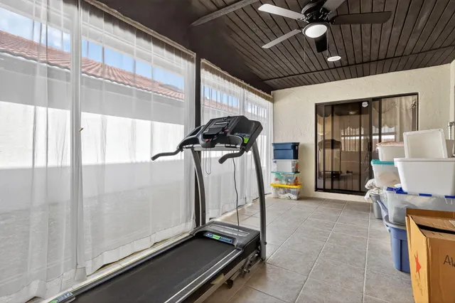 an aerial view of residential house with outdoor space and swimming pool