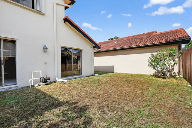 a view of a lake with houses in the background