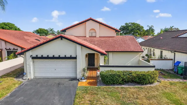 a view of a swimming pool with sitting area