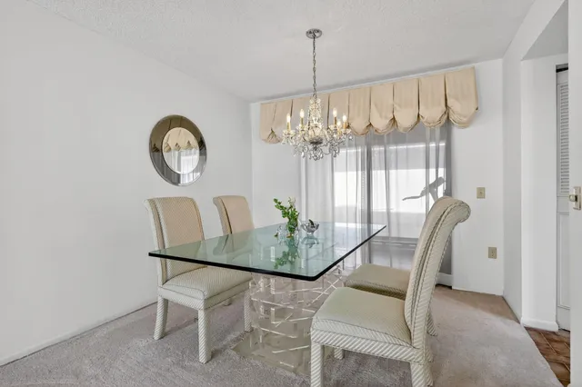a kitchen with granite countertop cabinets and white appliances
