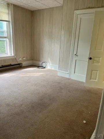 a view of an empty room and window