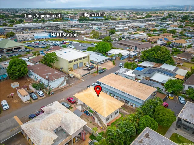 an aerial view of residential houses with outdoor space