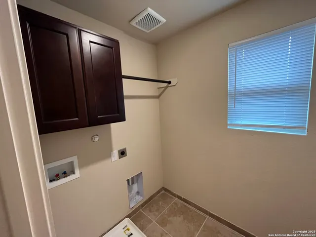 a view of storage and utility room with washer and dryer