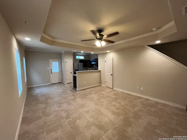 a view of a hallway with a sink and a stove top oven