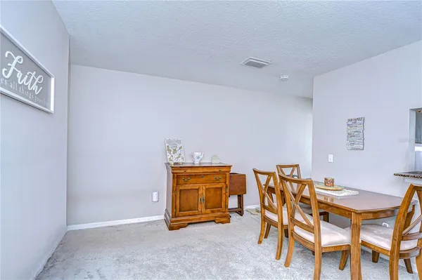 a dining room with furniture and a table