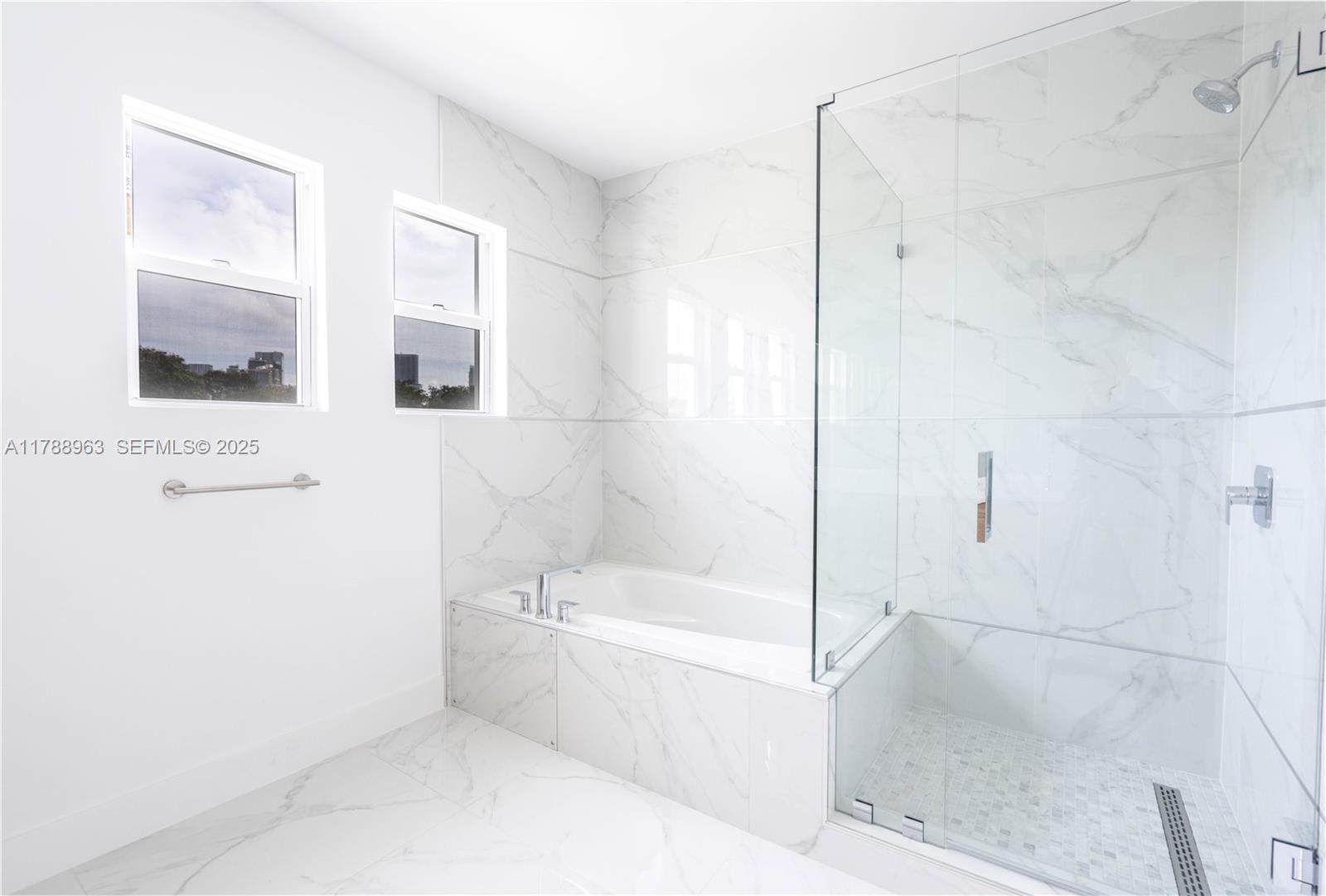 910 Southwest 24th Road Miami, FL 33129 - Photo 30 of 38 a bathroom with a bathtub and shower