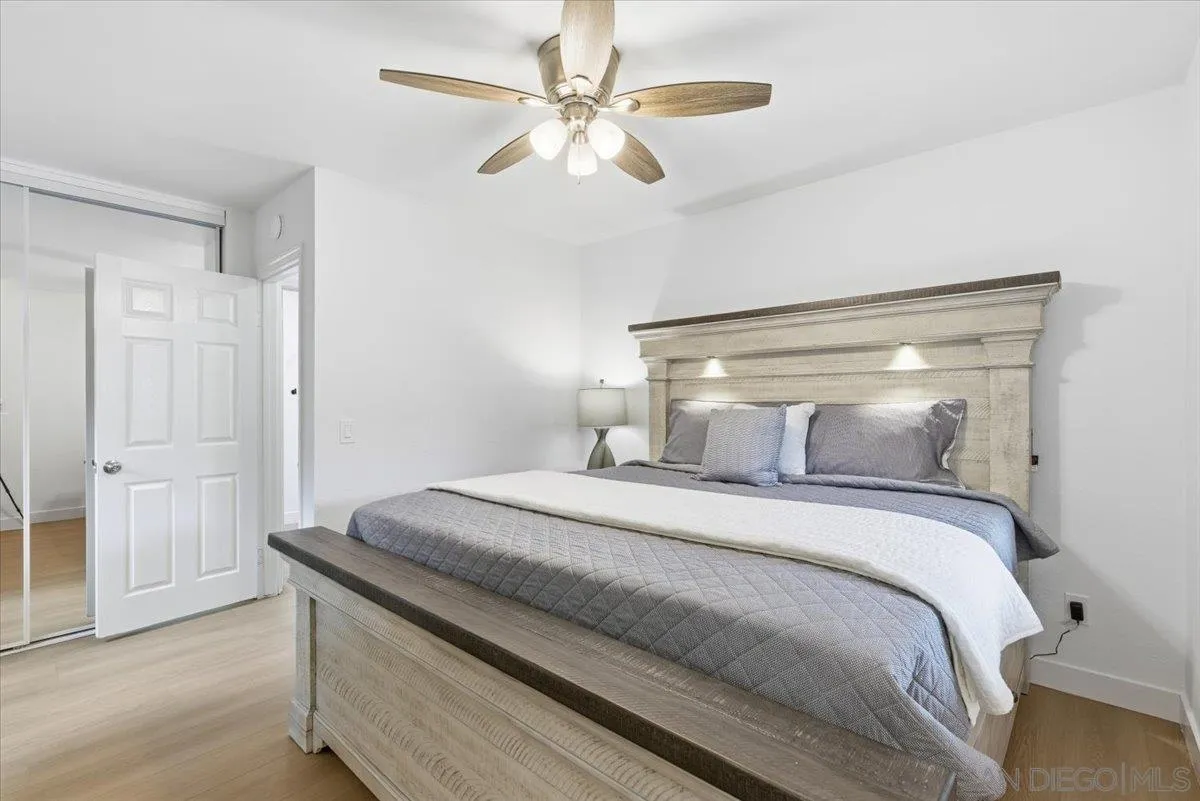 911 Jamacha Road El Cajon, CA 92019 - Photo 15 of 34 a bedroom with a bed and a ceiling fan