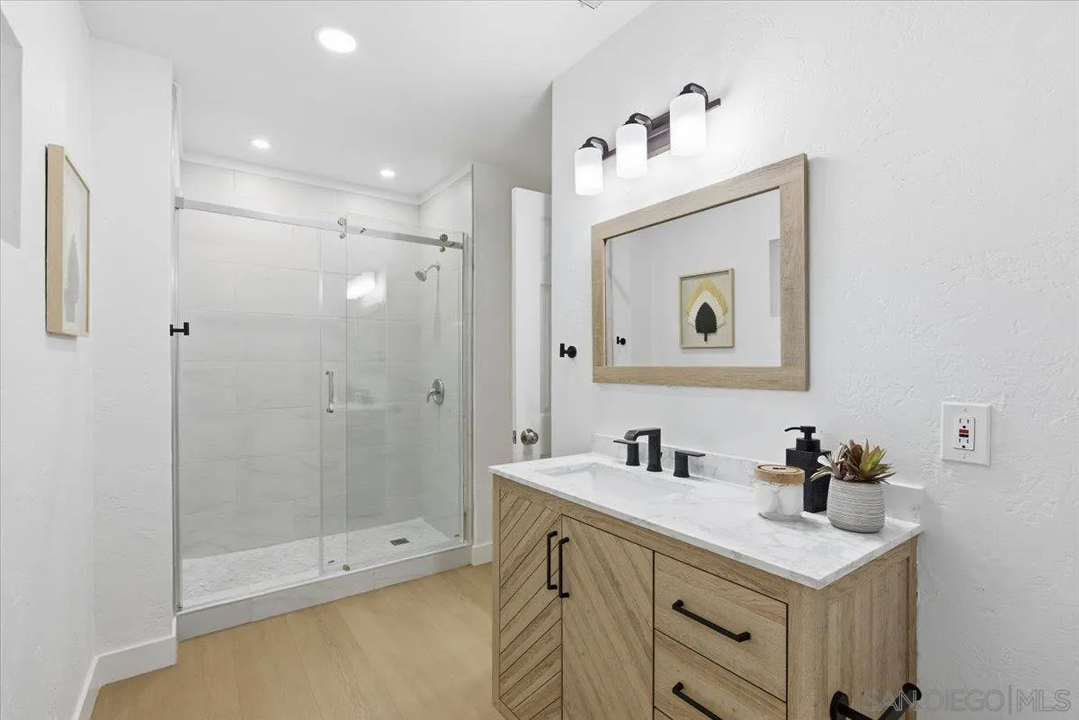 911 Jamacha Road El Cajon, CA 92019 - Photo 17 of 34 a bathroom with a sink vanity and a mirror