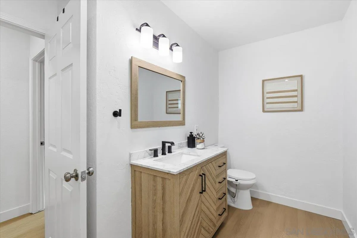 911 Jamacha Road El Cajon, CA 92019 - Photo 18 of 34 a bathroom with a toilet sink and mirror