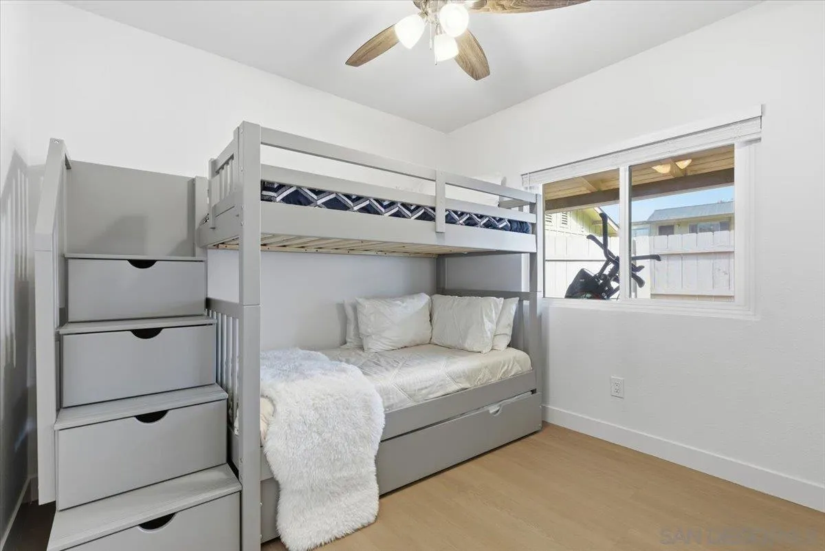 911 Jamacha Road El Cajon, CA 92019 - Photo 19 of 34 a bedroom with a bed and a window