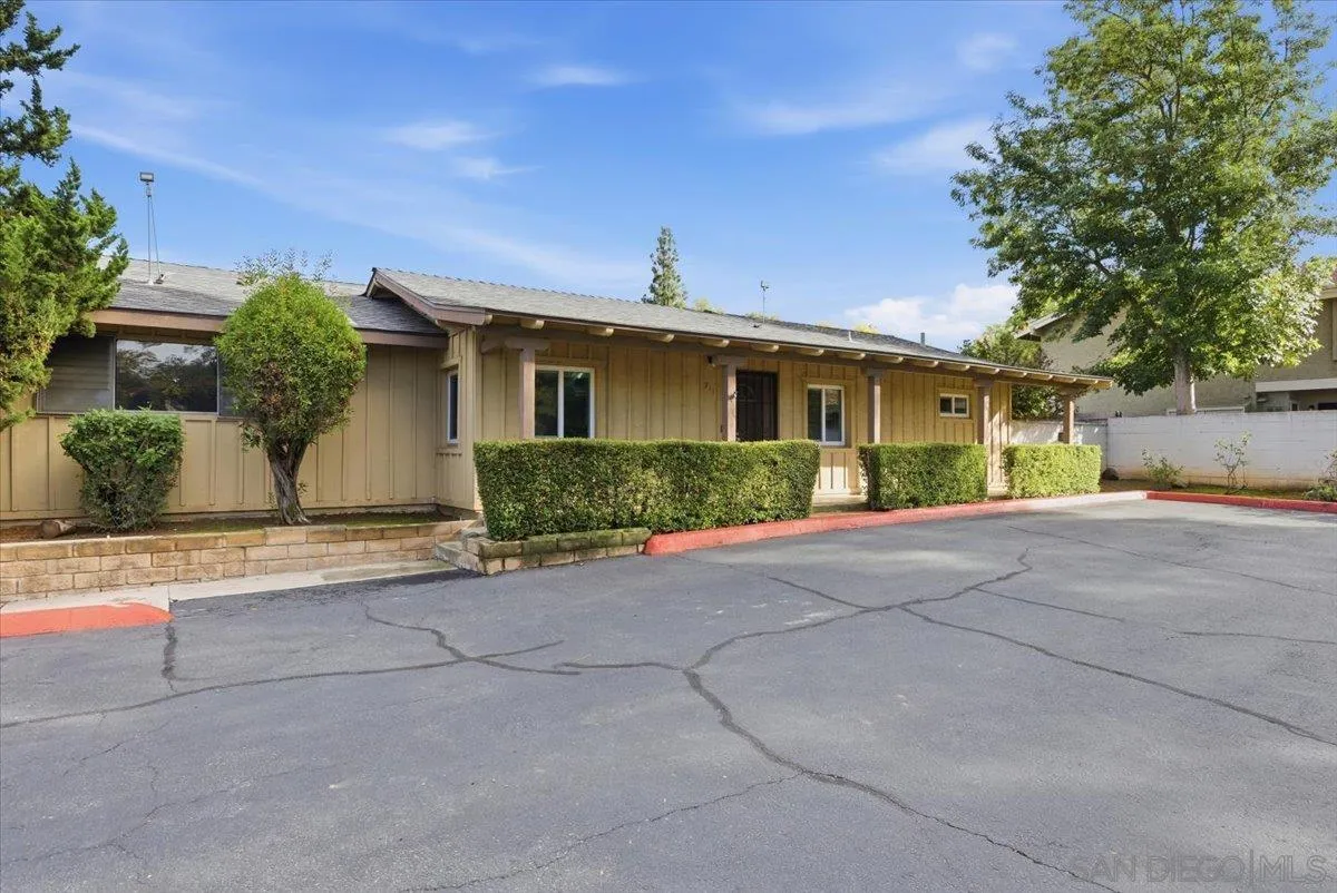 911 Jamacha Road El Cajon, CA 92019 - Photo 3 of 34 a front view of a house with a yard and potted plants