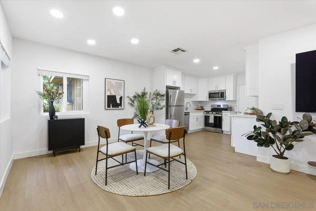 911 Jamacha Road El Cajon, CA 92019 - Photo 8 of 34 a living room with furniture and a dining table with kitchen view