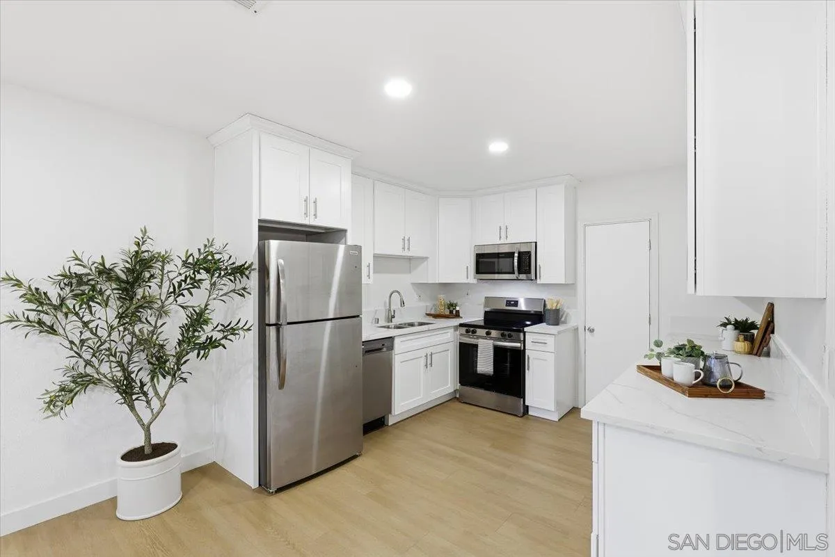 911 Jamacha Road El Cajon, CA 92019 - Photo 10 of 34 a kitchen with a refrigerator and a plant
