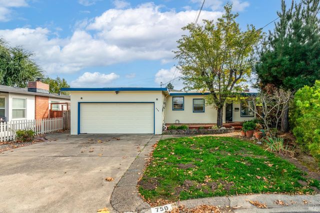 front view of a house with a small yard