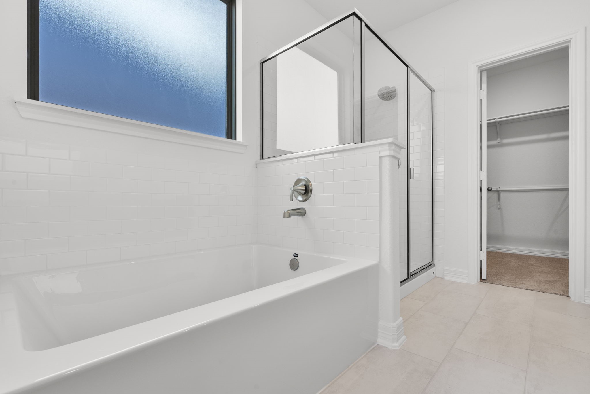 24218 Dewey Trail Magnolia, TX 77355 - Photo 14 of 38 a bathroom with a bathtub and a shower