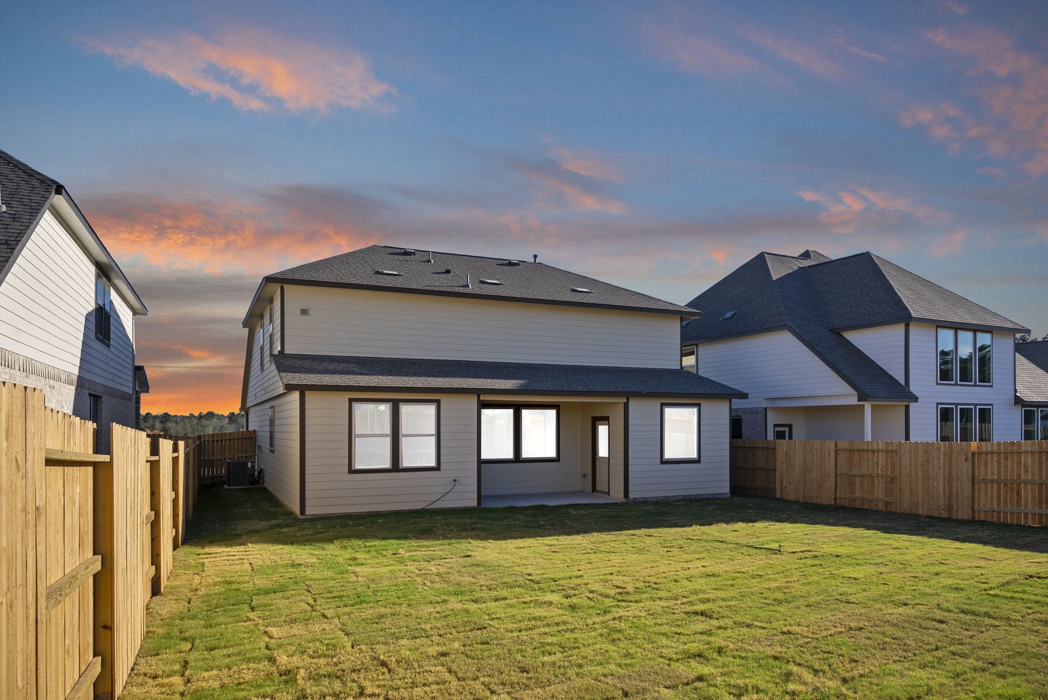 24218 Dewey Trail Magnolia, TX 77355 - Photo 30 of 38 a backyard of a house with large trees and wooden fence