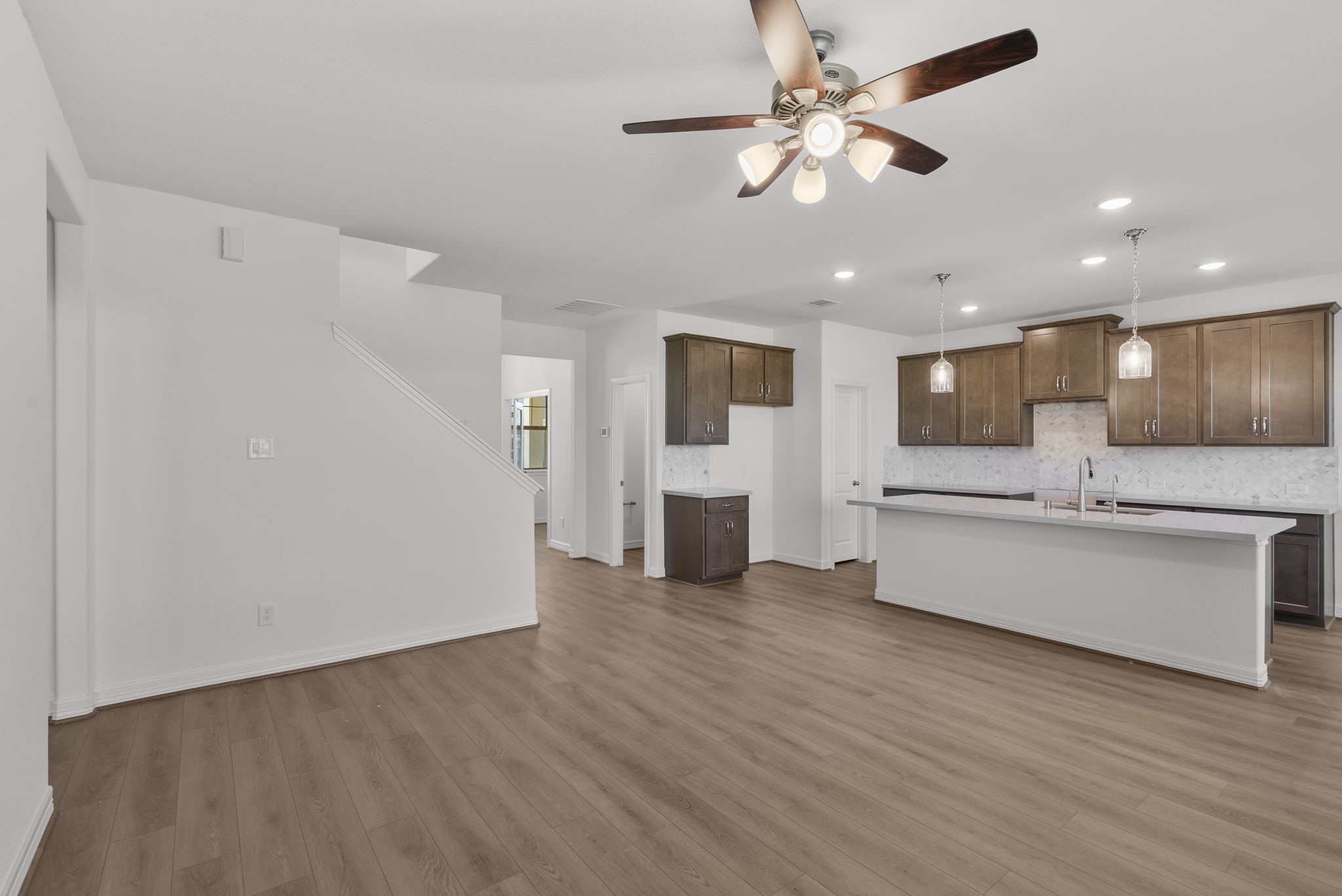 24218 Dewey Trail Magnolia, TX 77355 - Photo 8 of 38 a view of large kitchen with stainless steel appliances wooden floor and chandelier