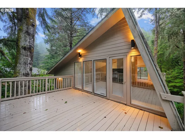 a view of balcony with wooden floor and fence
