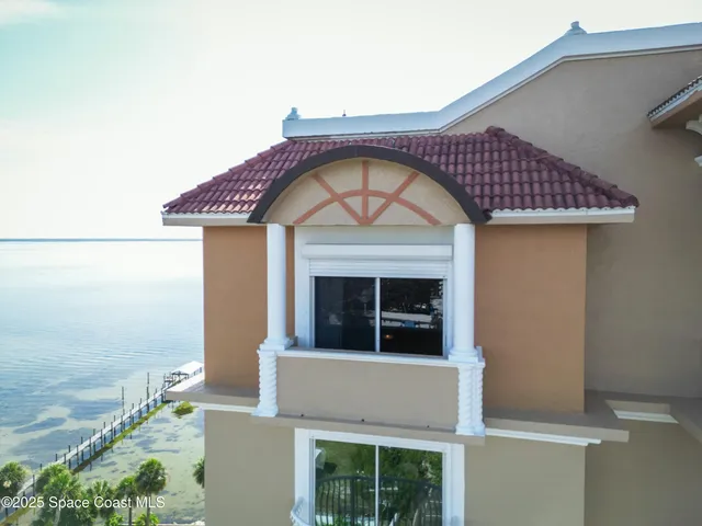 a view of a house with large windows