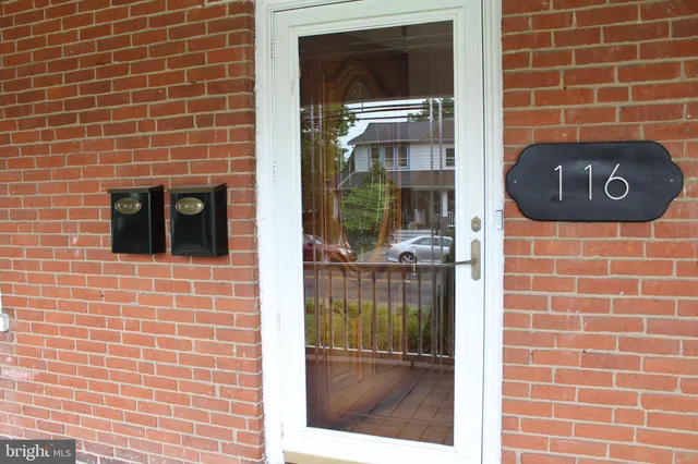 a view of a brick wall and a window