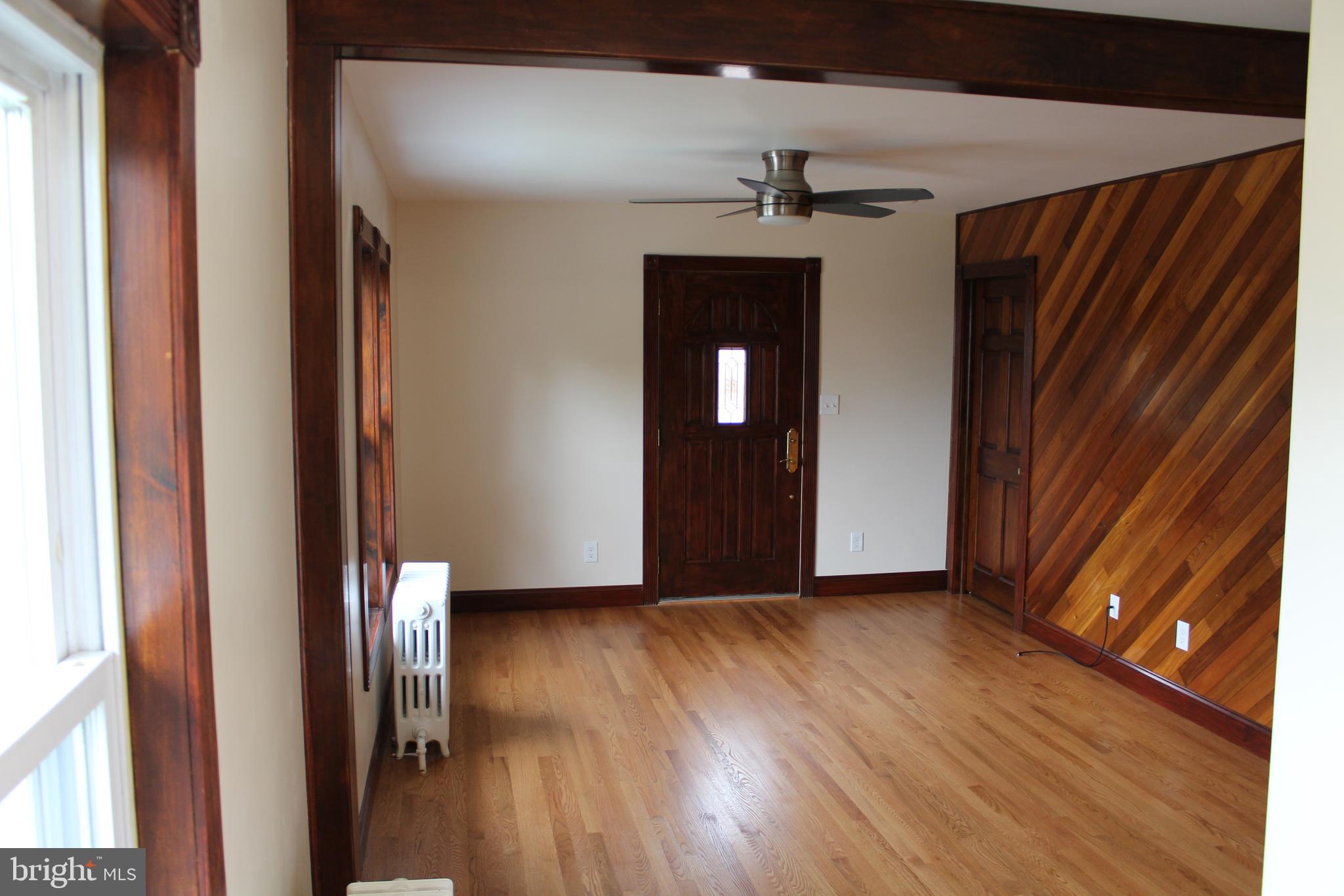 116 South Main Street, Unit 2 Telford, PA 18969 - Photo 5 of 23 a view of a livingroom with wooden floor