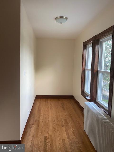 116 South Main Street, Unit 2 Telford, PA 18969 - Photo 6 of 23 a view of an empty room with wooden floor and a window