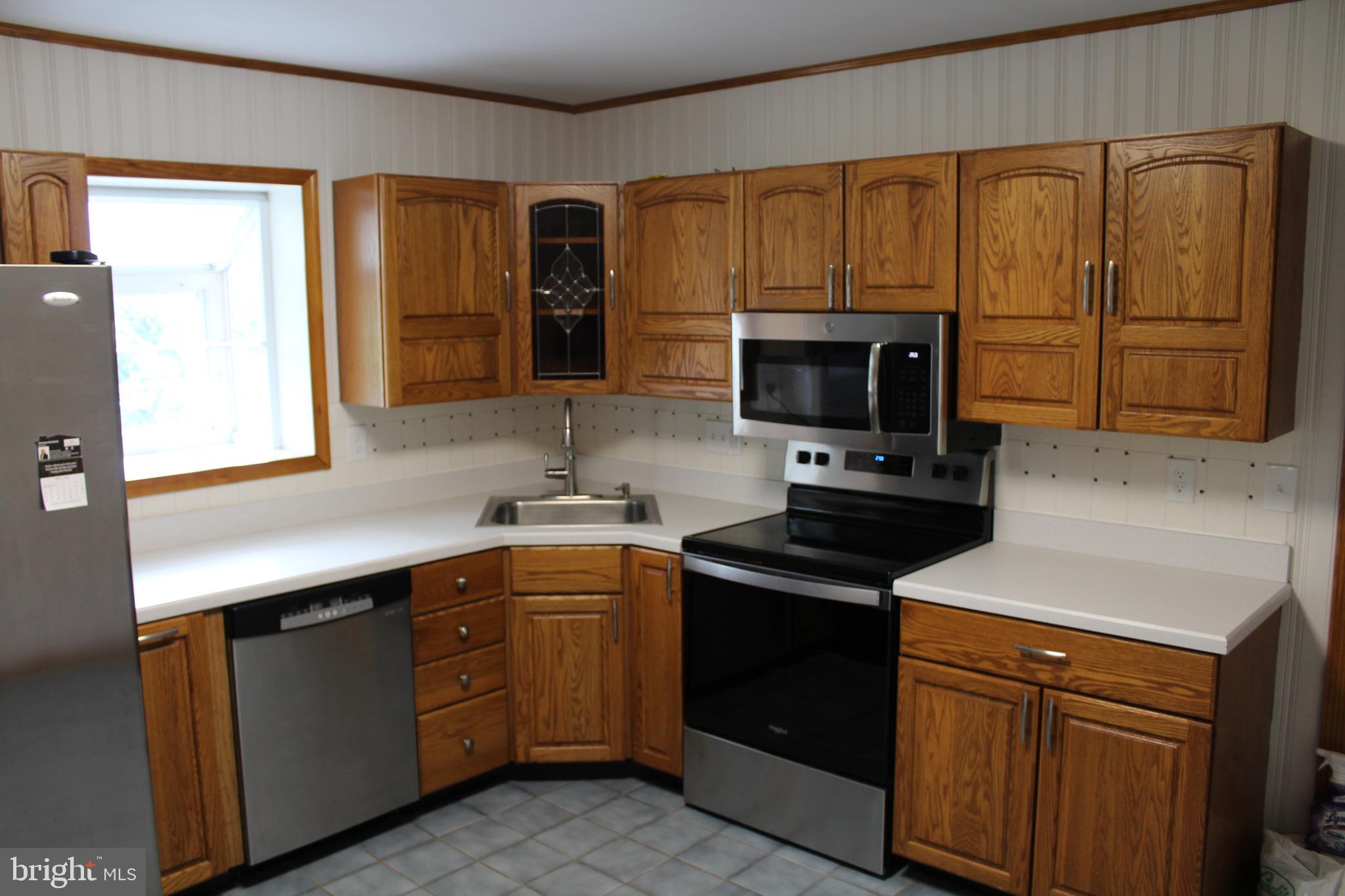 116 South Main Street, Unit 2 Telford, PA 18969 - Photo 7 of 23 a kitchen with a sink stove and microwave