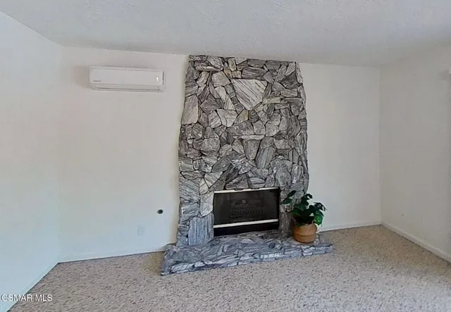 a kitchen with a table chairs and a potted plant