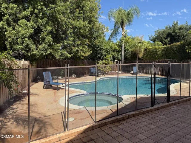 a view of a backyard with couches