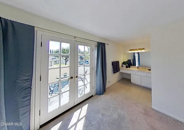 a view of a chairs and table in the patio
