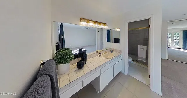 a view of a house with backyard porch and sitting area