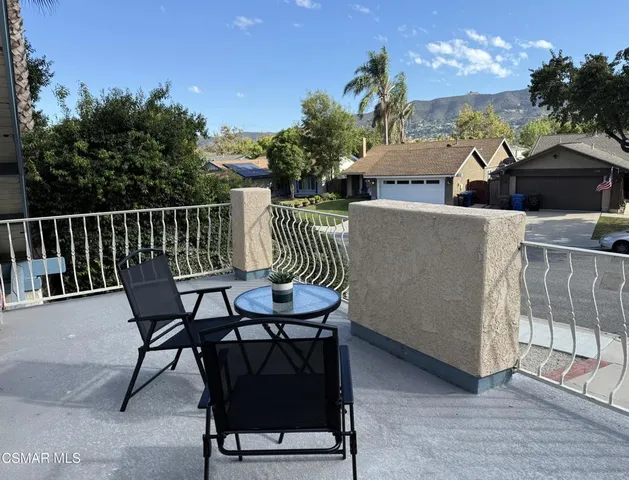 a view of a chairs and table in the terrace
