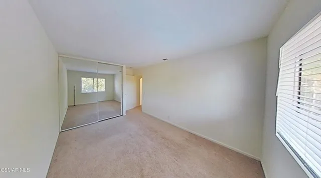 an outdoor space with pool and furniture