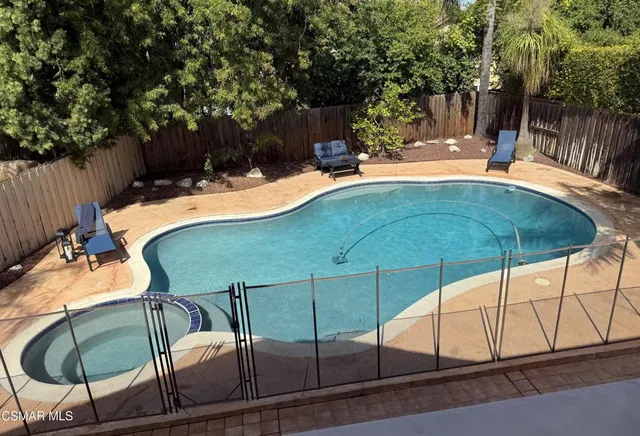 a view of a hallway with white walls and stairs