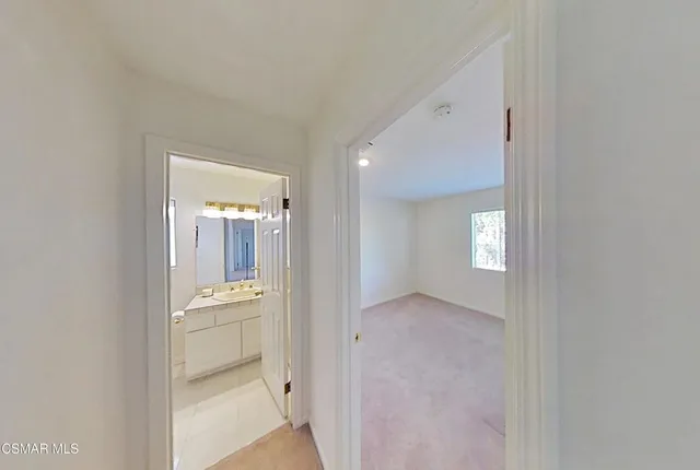 a view of a patio with a dining table and chairs