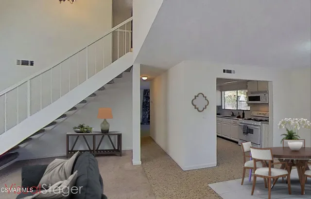 a dining room with furniture and window