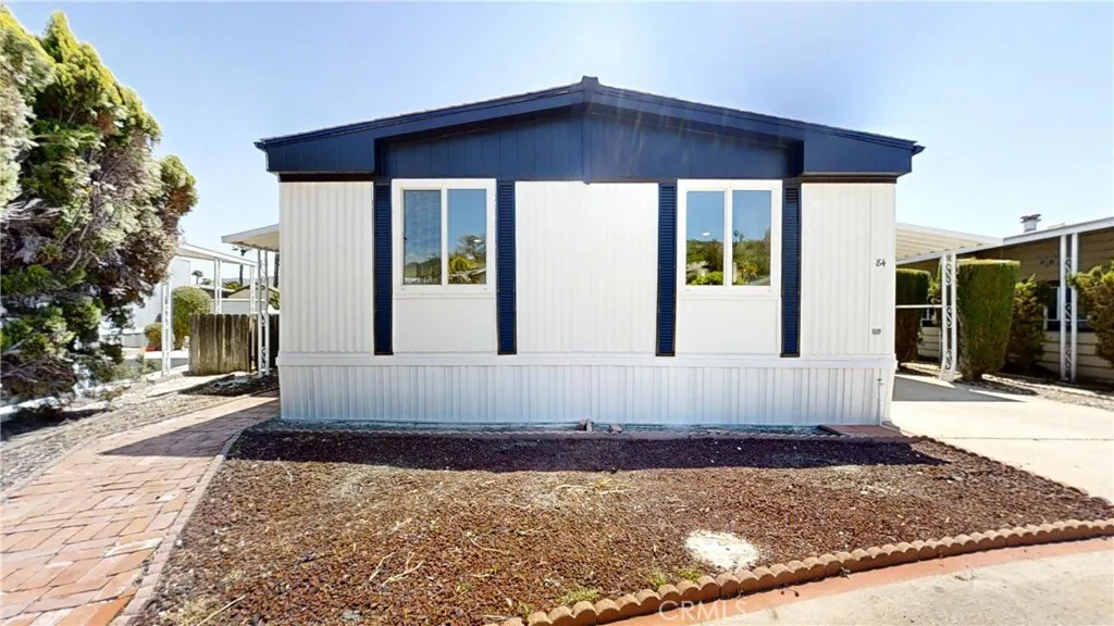 3745 Valley Walnut Ca, Unit 84 Walnut, CA 91789 - Photo 13 of 18 a view of a house with a yard
