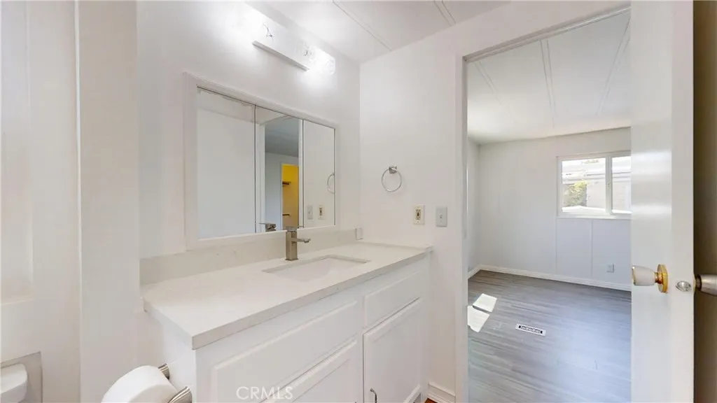 3745 Valley Walnut Ca, Unit 84 Walnut, CA 91789 - Photo 10 of 18 a bathroom with a sink and a mirror