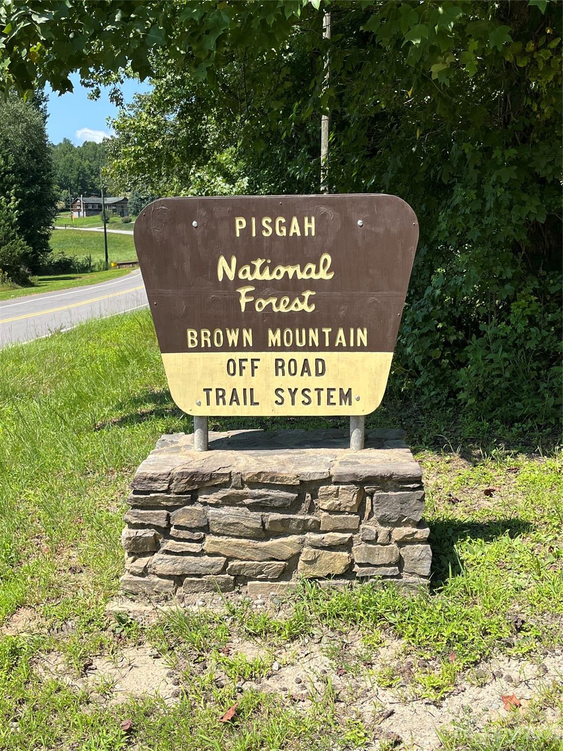 Tbd Tbd Collettsville Road, Unit 15 Lenoir, NC 28645 - Photo 16 of 20 a sign on the side of the road