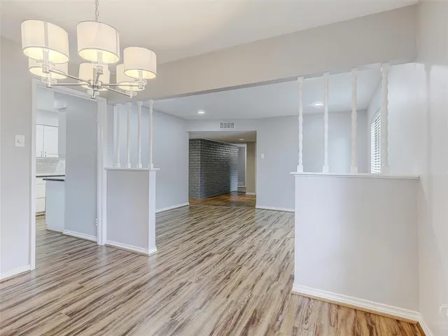 a view of a livingroom with wooden floor