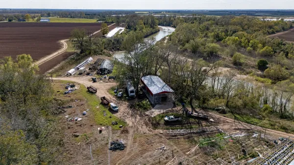 an aerial view of a house with a lake view