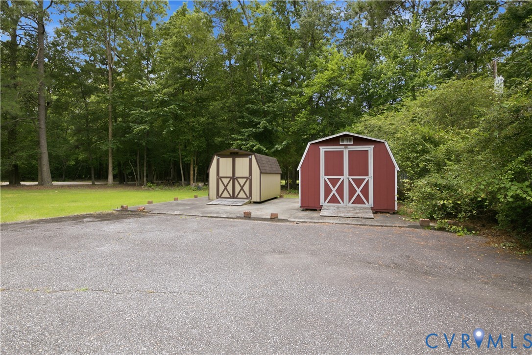 2500 Patricia Road Richmond, VA 23231 - Photo 25 of 34 Two storage sheds with barn-style doors situated o