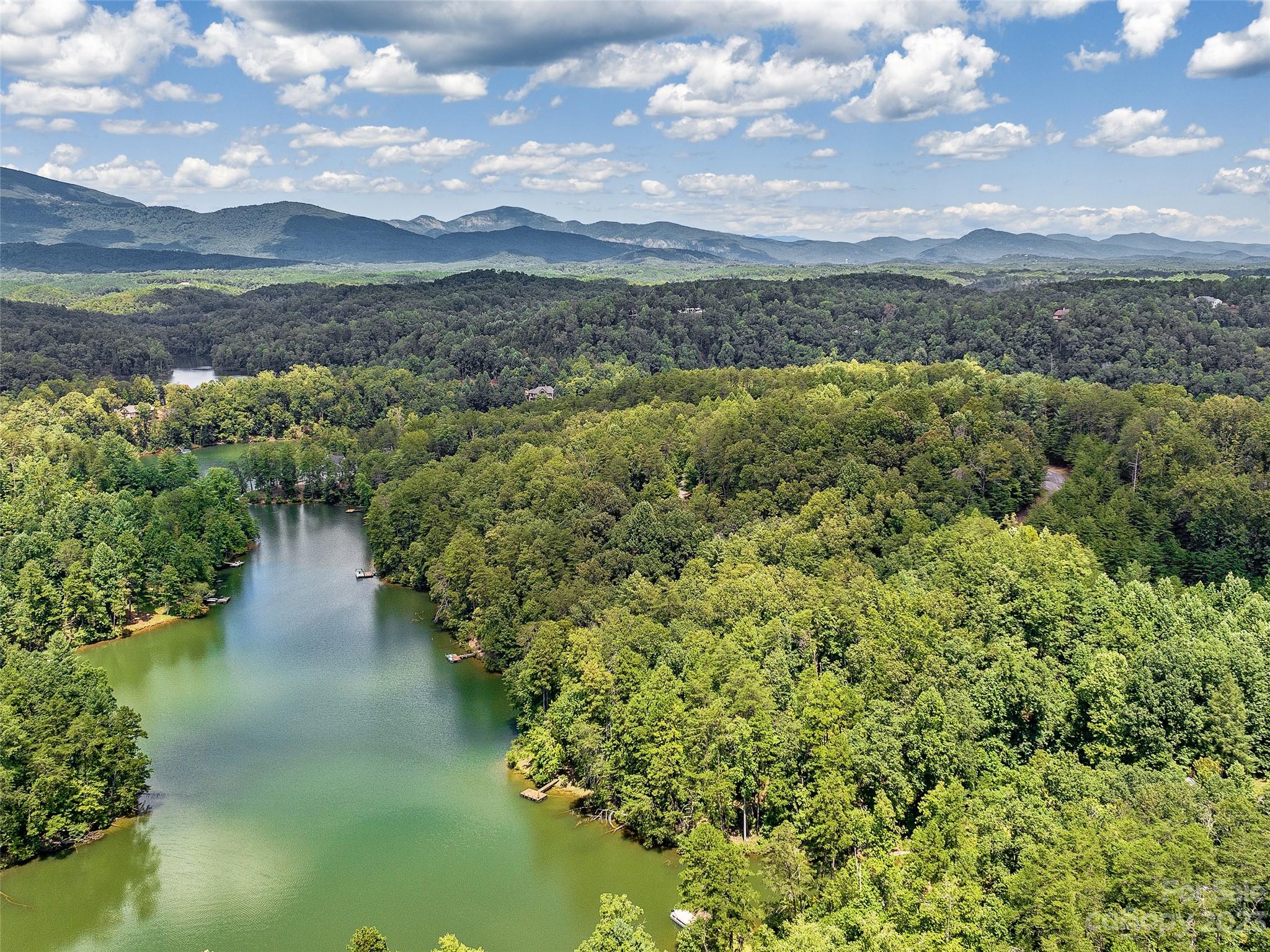 Lot 17 South Cove Road Mill Spring, NC 28756 - Photo 17 of 33 a view of a lake with a mountain