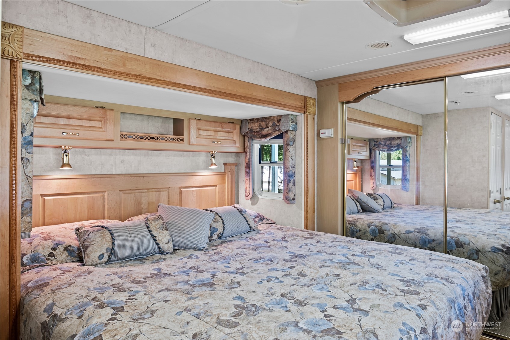 296 Cedar Hills Road Longview, WA 98632 - Photo 18 of 27 a bedroom with a large bed and wooden floor