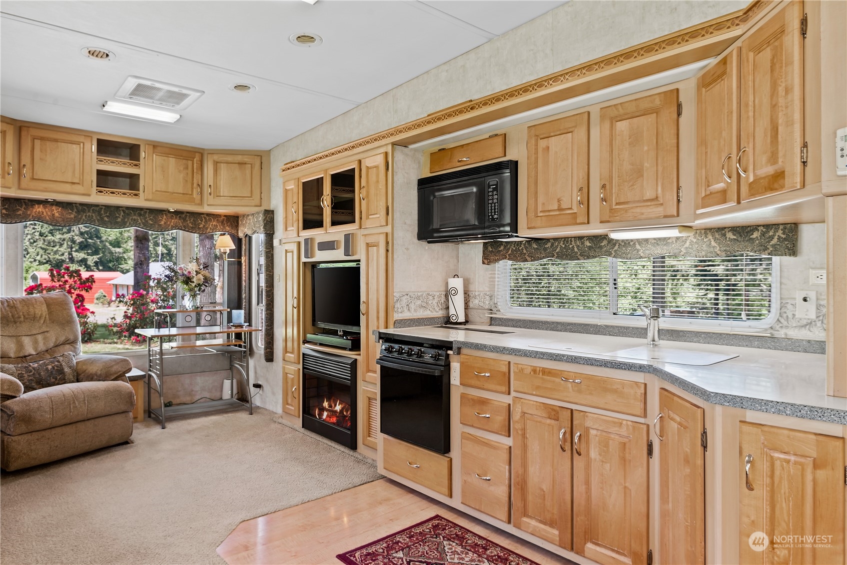 296 Cedar Hills Road Longview, WA 98632 - Photo 22 of 27 a kitchen with stainless steel appliances granite countertop a refrigerator and stove top oven
